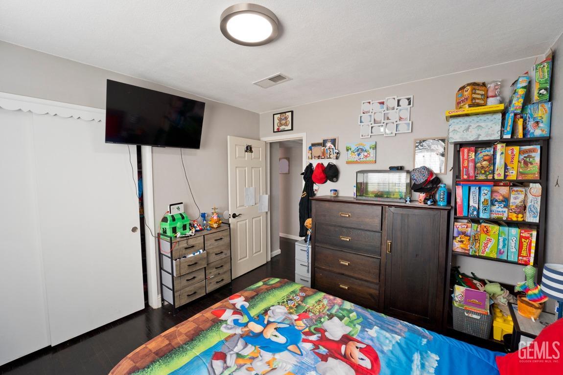 Undisclosed Address Bakersfield, CA 93306 - Photo 13 of 20 a room with furniture and a flat screen tv