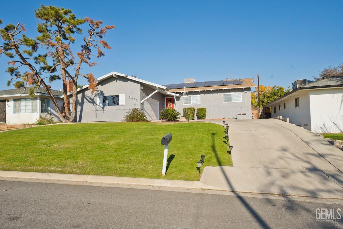 Undisclosed Address Bakersfield, CA 93306 - Photo 2 of 20 a front view of house with yard