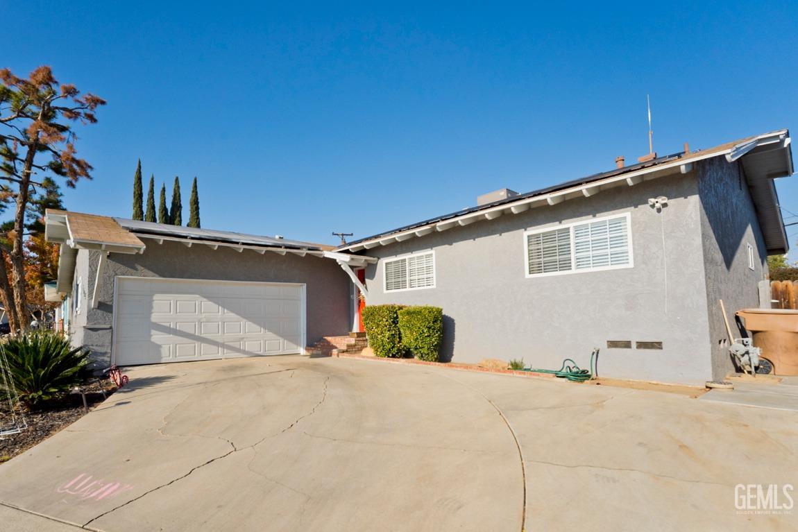 Undisclosed Address Bakersfield, CA 93306 - Photo 3 of 20 a front view of a house with a yard
