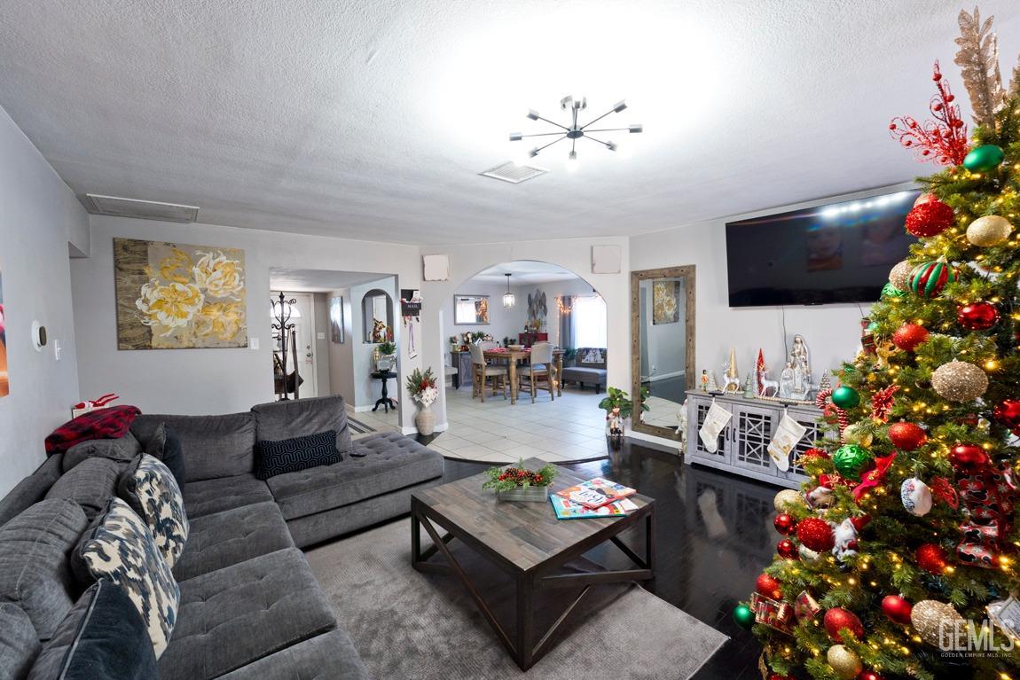 Undisclosed Address Bakersfield, CA 93306 - Photo 5 of 20 a living room with furniture and a flat screen tv