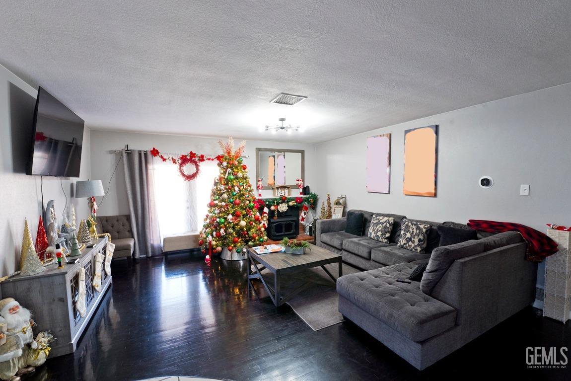 Undisclosed Address Bakersfield, CA 93306 - Photo 6 of 20 a living room with furniture and a flat screen tv