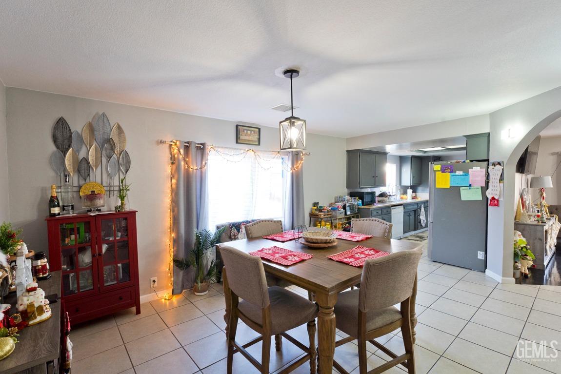 Undisclosed Address Bakersfield, CA 93306 - Photo 7 of 20 a view of a dining room with furniture and a chandelier