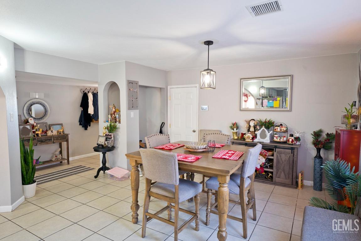 Undisclosed Address Bakersfield, CA 93306 - Photo 8 of 20 a view of a dining room with furniture