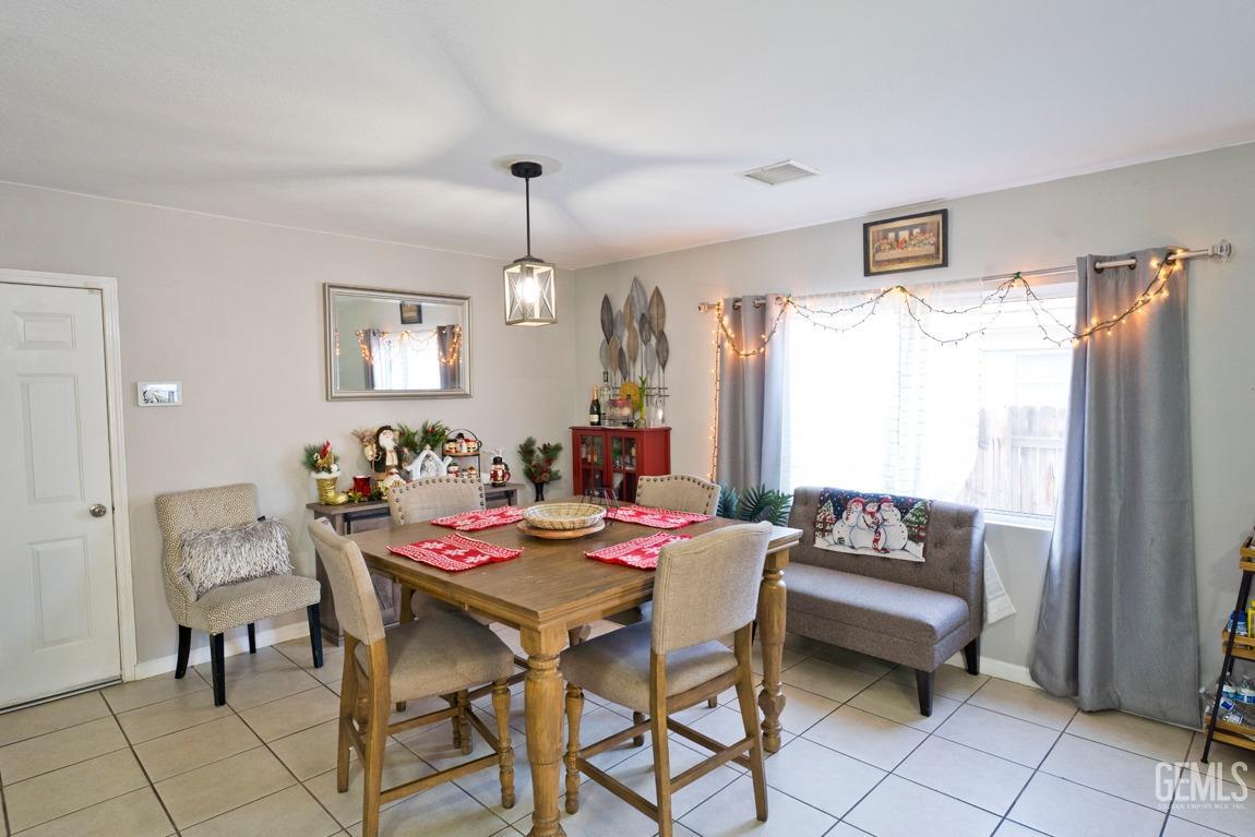 Undisclosed Address Bakersfield, CA 93306 - Photo 9 of 20 a view of a dining room with furniture
