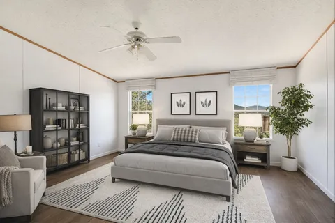 a bedroom with a large bed and a couch