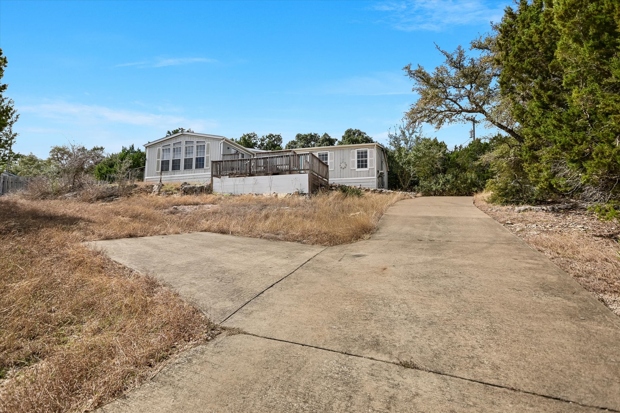 217 Rousey Street Canyon Lake, TX 78133 - Photo 5 of 25 a city view with tall buildings and a big yard