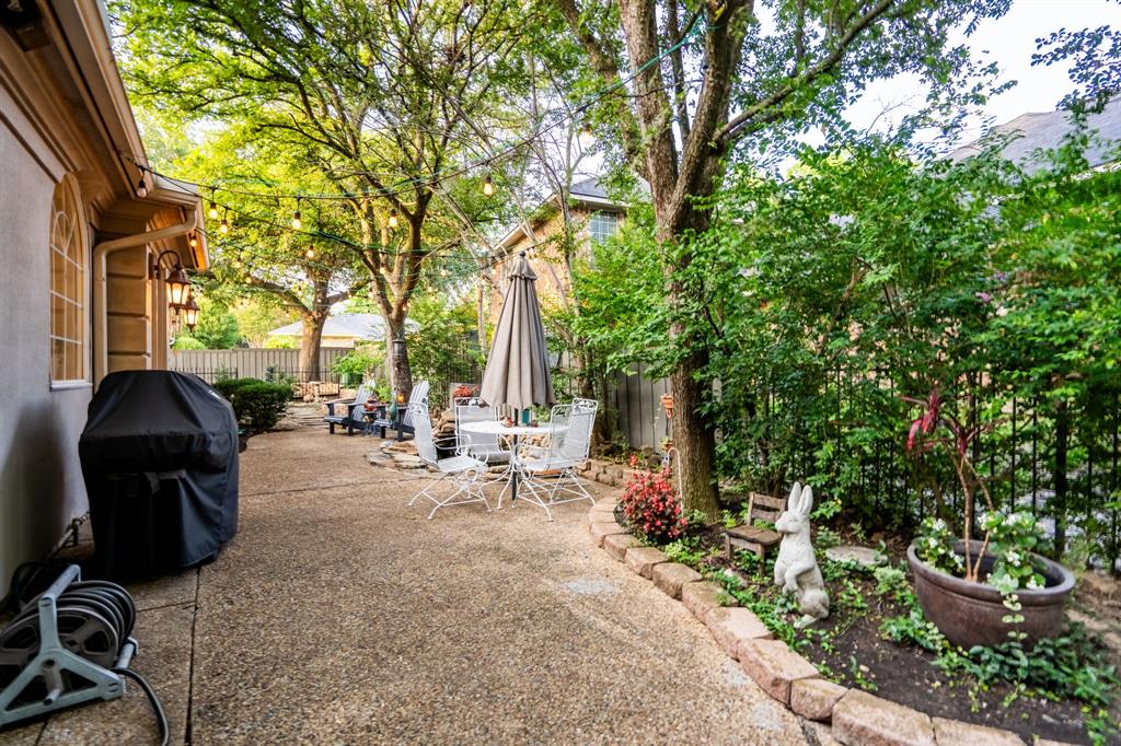 1450 Meandering Way Rockwall, TX 75087 - Photo 27 of 29 a view of a backyard with sitting area and furniture