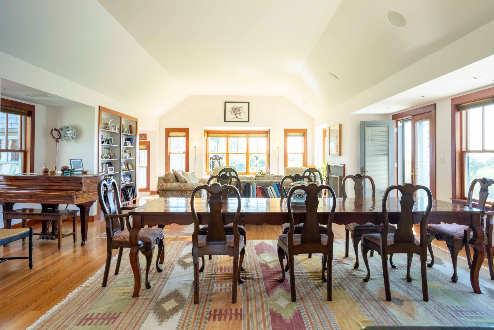 135 Capawock Road West Tisbury, MA 02568 - Photo 14 of 25 a view of a dining room and livingroom with furniture window and wooden floor