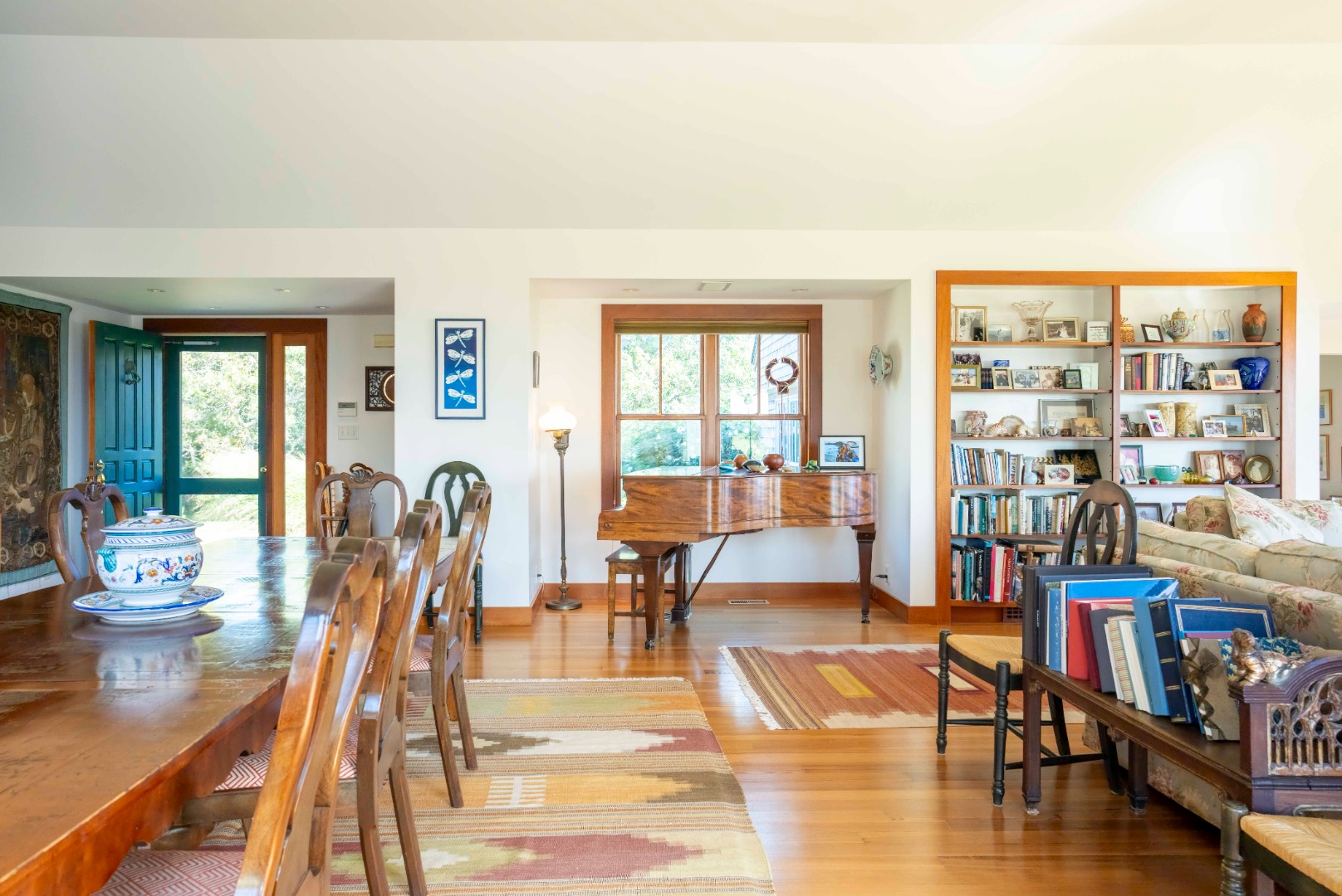 135 Capawock Road West Tisbury, MA 02568 - Photo 17 of 25 a living room with furniture and a book shelf