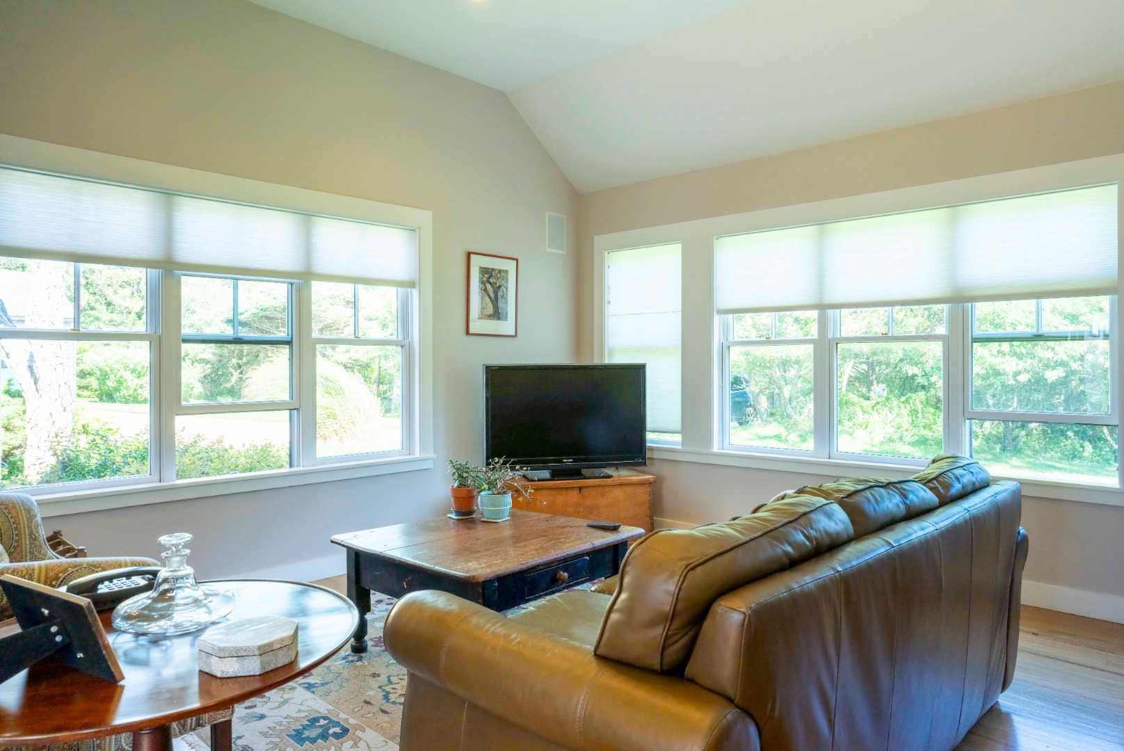 135 Capawock Road West Tisbury, MA 02568 - Photo 21 of 25 a living room with furniture and a flat screen tv