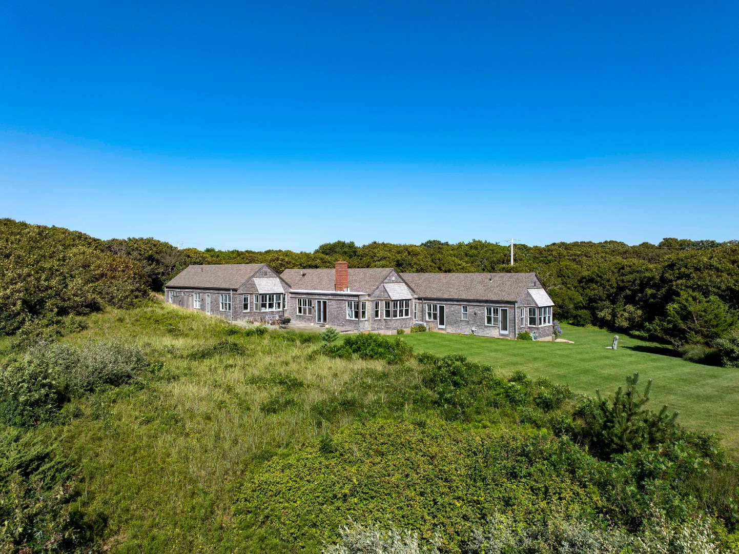 135 Capawock Road West Tisbury, MA 02568 - Photo 4 of 25 a view of a house with a yard