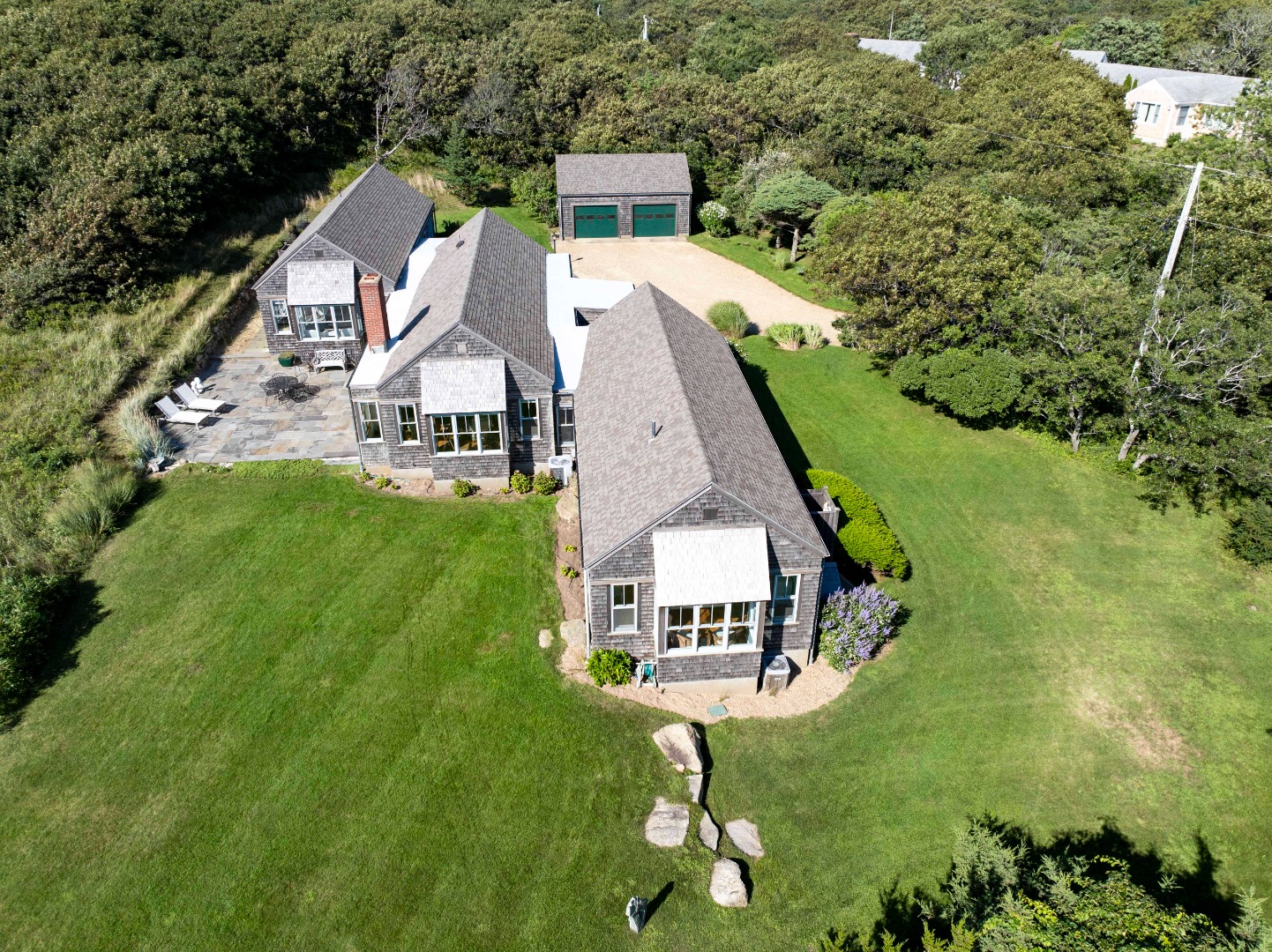 135 Capawock Road West Tisbury, MA 02568 - Photo 5 of 25 a aerial view of a house with swimming pool and garden