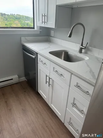 a kitchen with a sink and cabinets
