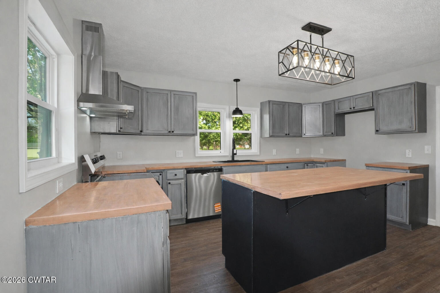 4177 Gum Flat Road Bells, TN 38006 - Photo 17 of 30 a kitchen with stainless steel appliances granite countertop a sink a stove and a refrigerator