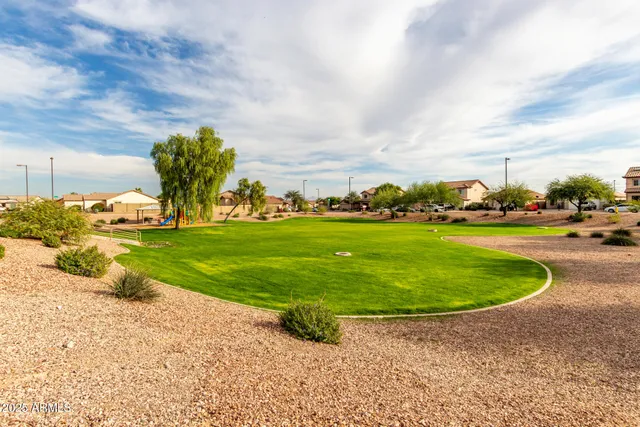 a view of a swimming pool with a yard