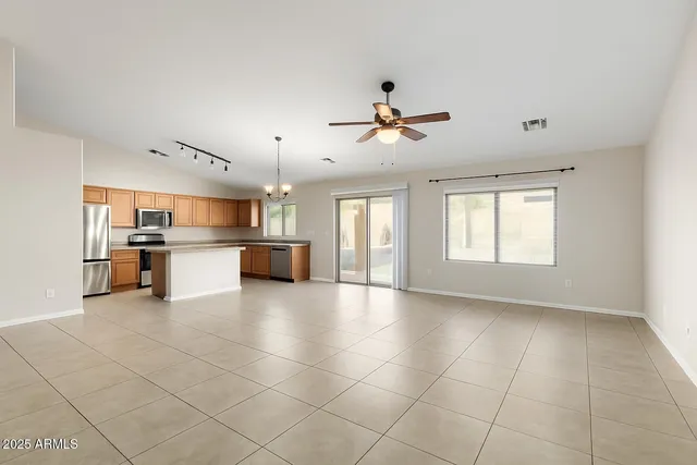a view of a kitchen with furniture and windows