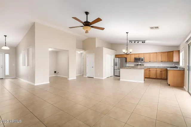 a view of a kitchen with a sink and a window