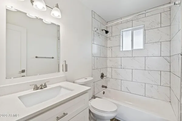 a view of a hallway with washer and dryer