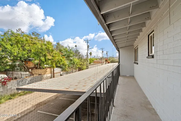 a view of a swimming pool with a patio