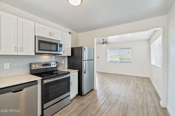 a kitchen with a refrigerator a sink and dishwasher