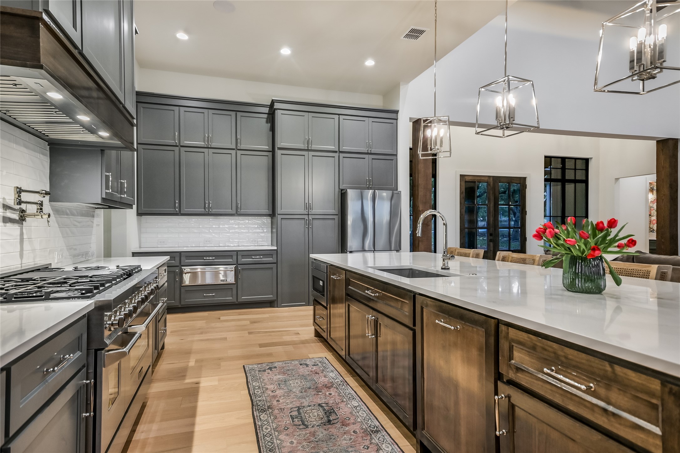 207 Gwendolyns Trail Wimberley, TX 78676 - Photo 9 of 40 a kitchen with kitchen island granite countertop a sink and a stove