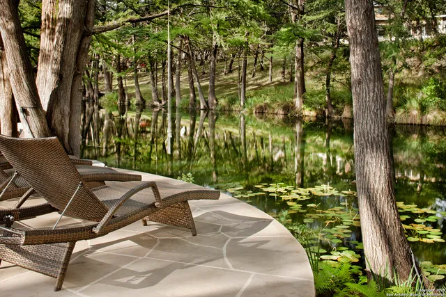 a view of a backyard with sitting area