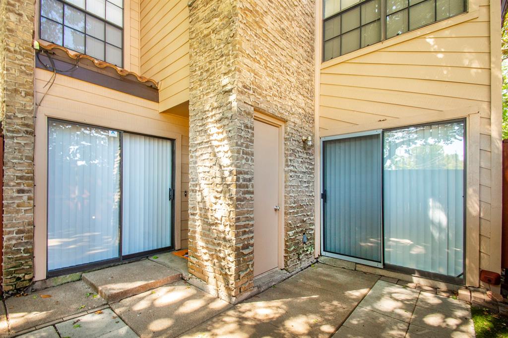 5626 Preston Oaks Road, Unit 9B Dallas, TX 75254 - Photo 19 of 20 a view of entryway with brick walls