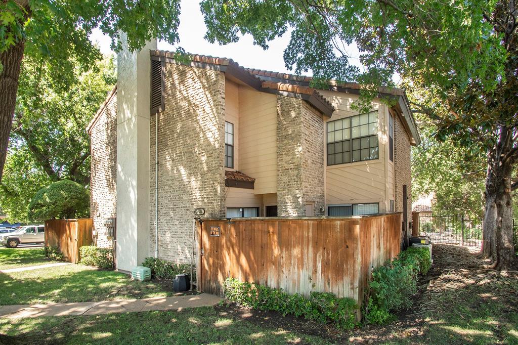 5626 Preston Oaks Road, Unit 9B Dallas, TX 75254 - Photo 20 of 20 a view of a back yard of the house