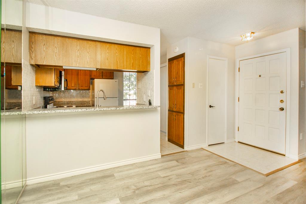 5626 Preston Oaks Road, Unit 9B Dallas, TX 75254 - Photo 8 of 20 a view of kitchen with a refrigerator cabinets and a sink