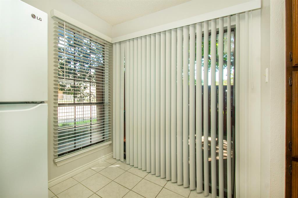 5626 Preston Oaks Road, Unit 9B Dallas, TX 75254 - Photo 9 of 20 a view of a porch with a door