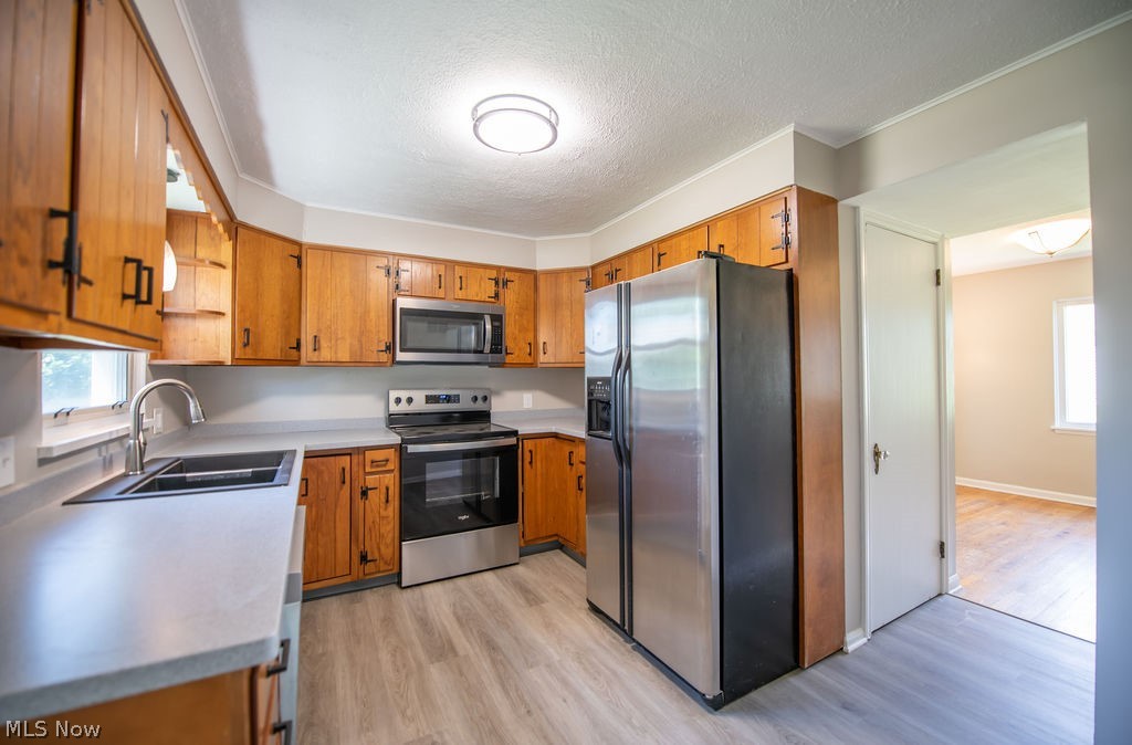 4221 2nd Street Northwest Canton, OH 44708 - Photo 12 of 35 Kitchen with stainless steel appliances and modern cabinetry.