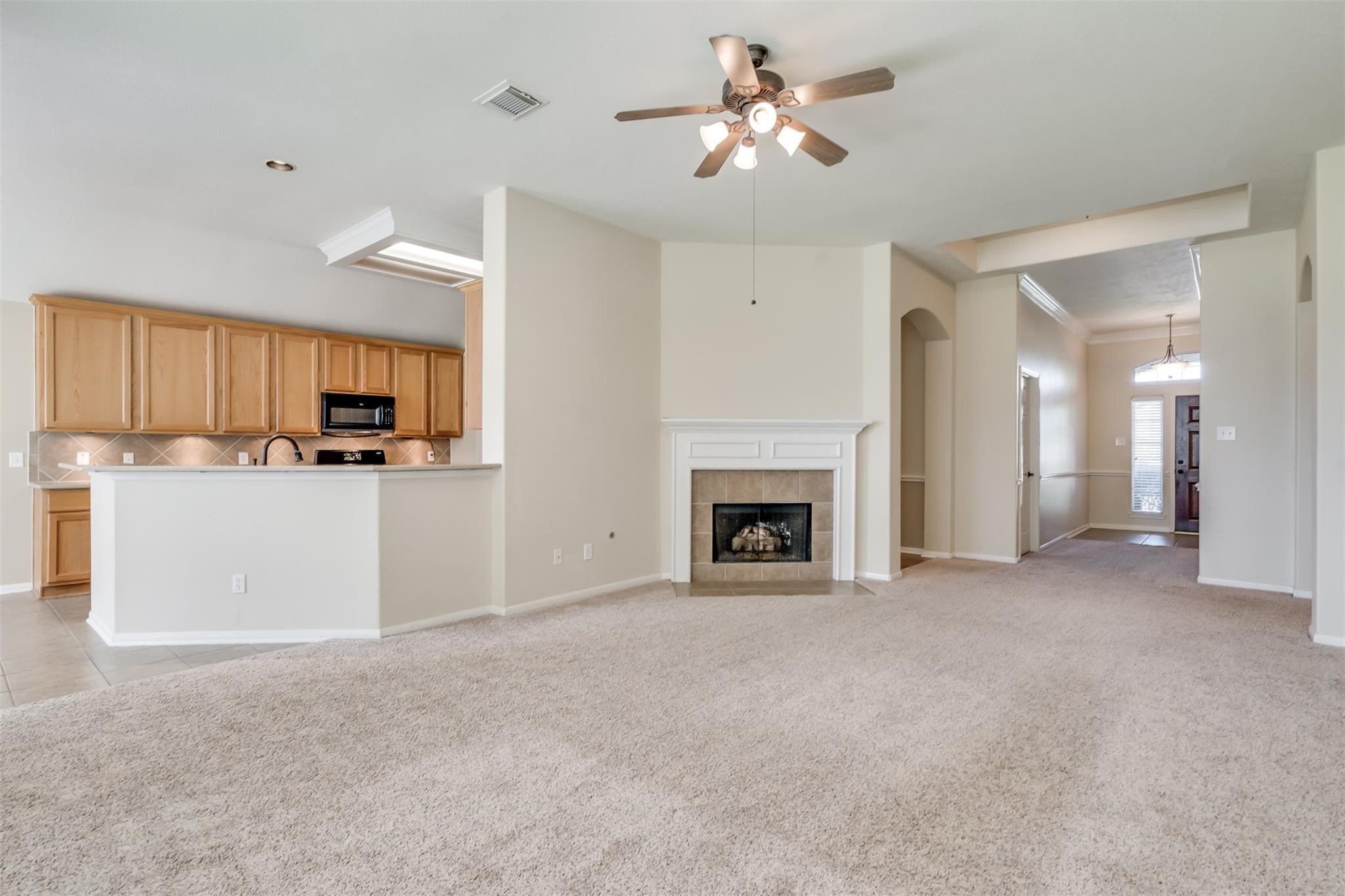 3419 La Fleur Lane Spring, TX 77388 - Photo 9 of 26 a view of a kitchen with electric appliances and chandelier fan