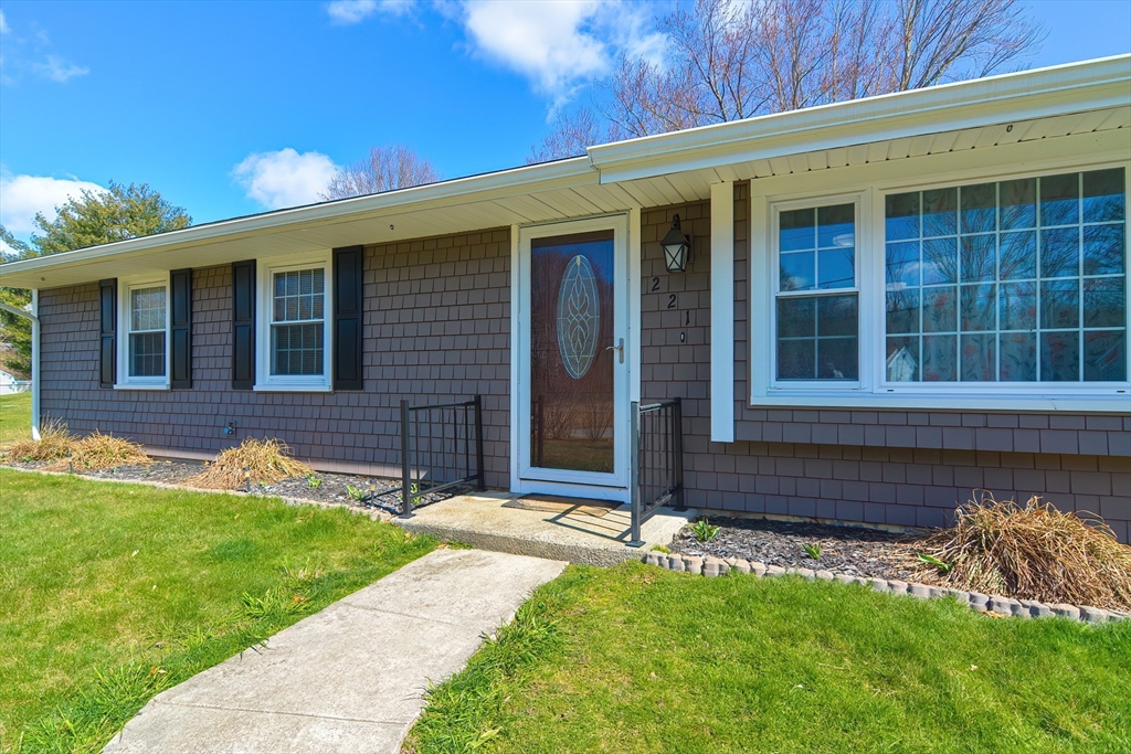 221 Smoke Rise Circle Swansea, MA 02777 - Photo 1 of 25 front view of a house with a yard