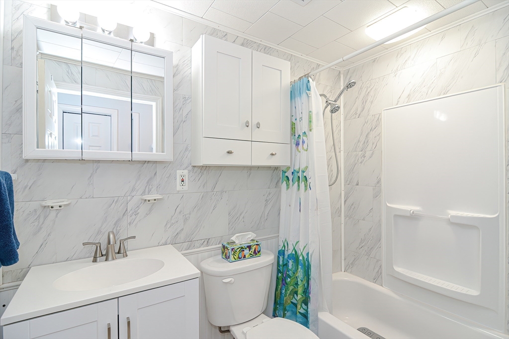221 Smoke Rise Circle Swansea, MA 02777 - Photo 12 of 25 a bathroom with a sink toilet and shower