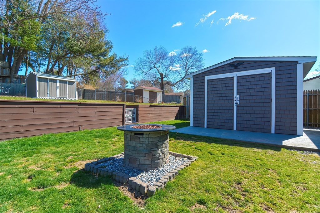 221 Smoke Rise Circle Swansea, MA 02777 - Photo 18 of 25 a front view of a house with garden