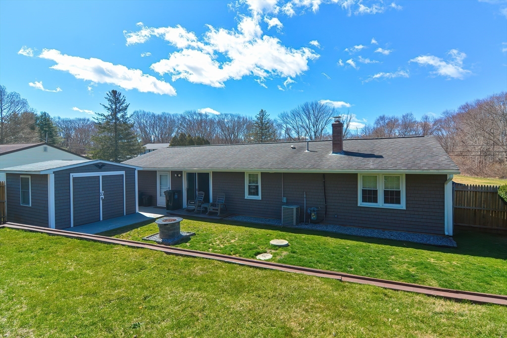 221 Smoke Rise Circle Swansea, MA 02777 - Photo 21 of 25 a view of a house with a backyard