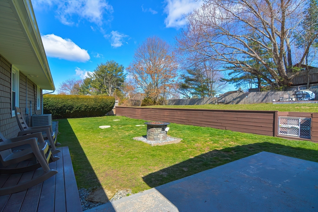 221 Smoke Rise Circle Swansea, MA 02777 - Photo 22 of 25 a view of a back yard of the house