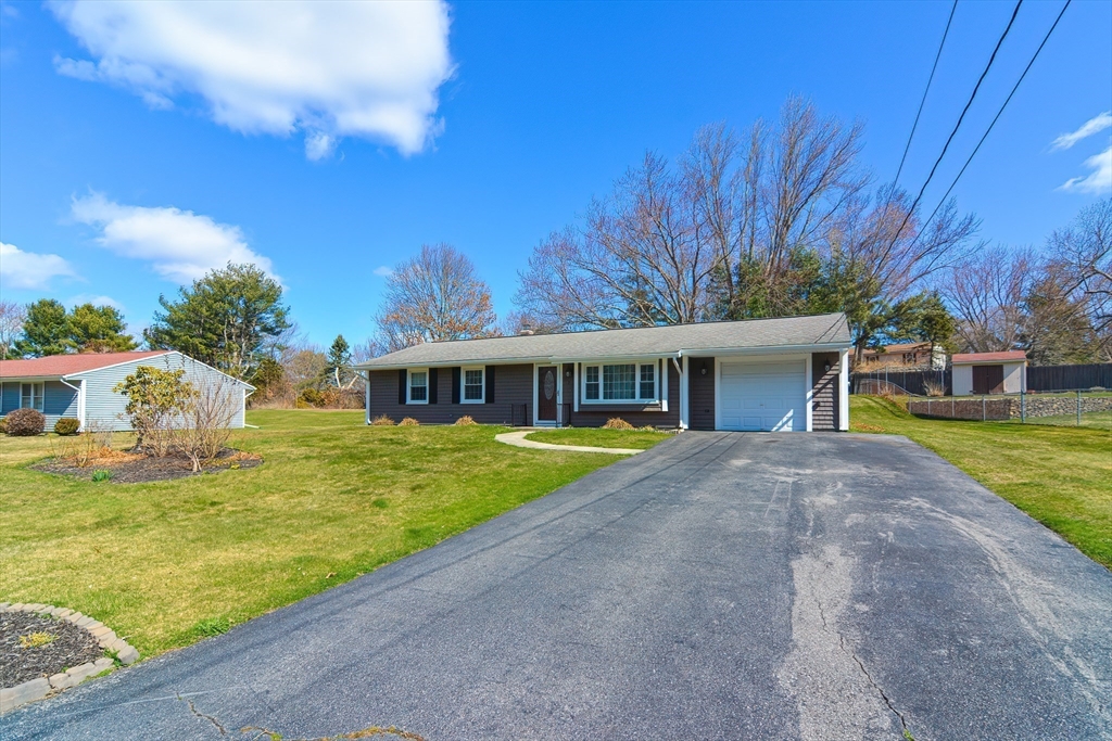 221 Smoke Rise Circle Swansea, MA 02777 - Photo 23 of 25 a front view of a house with garden