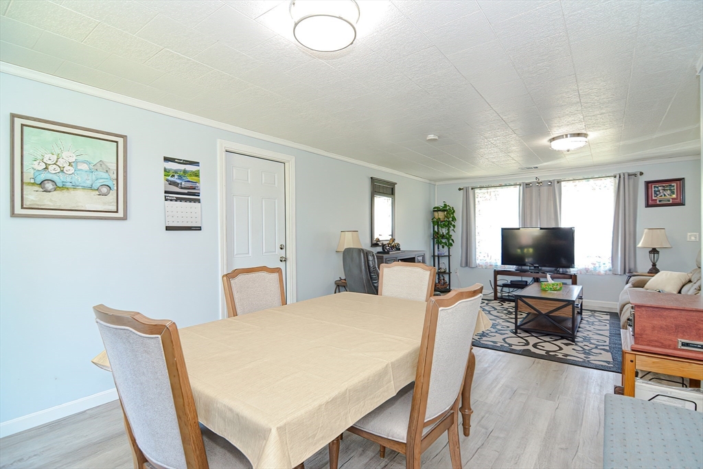 221 Smoke Rise Circle Swansea, MA 02777 - Photo 6 of 25 a living room with furniture and a flat screen tv