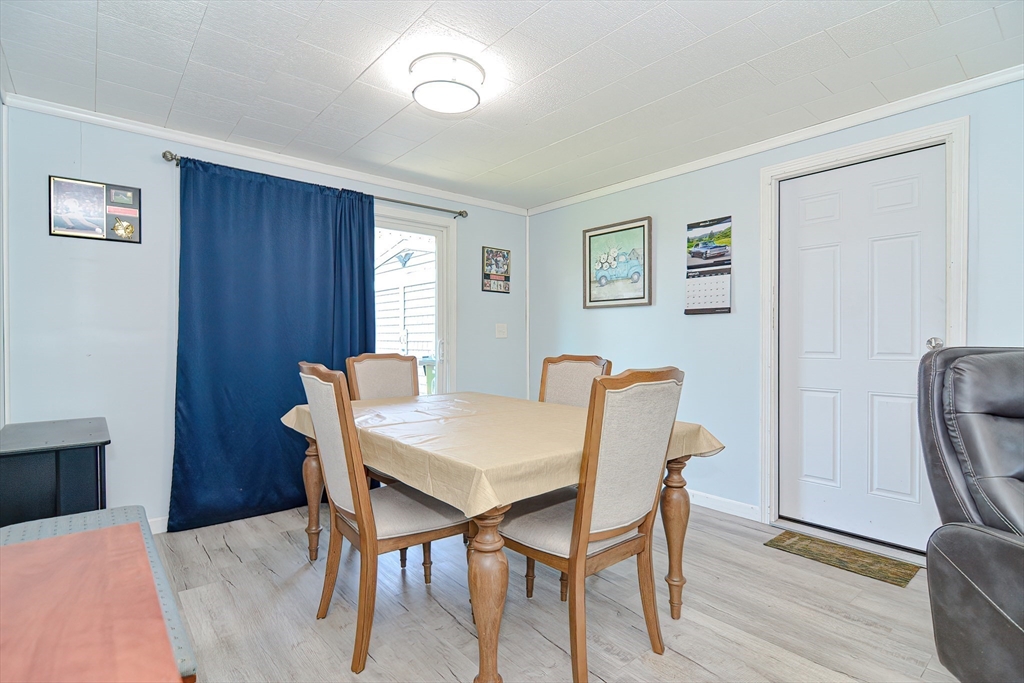 221 Smoke Rise Circle Swansea, MA 02777 - Photo 7 of 25 a view of a dining room with furniture and wooden floor