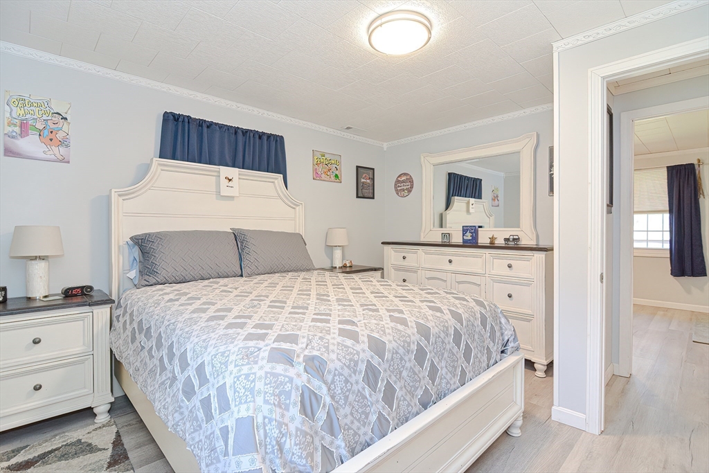 221 Smoke Rise Circle Swansea, MA 02777 - Photo 8 of 25 a bedroom with a bed and a night stand