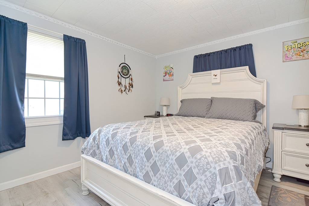 221 Smoke Rise Circle Swansea, MA 02777 - Photo 9 of 25 a bedroom with a bed and window