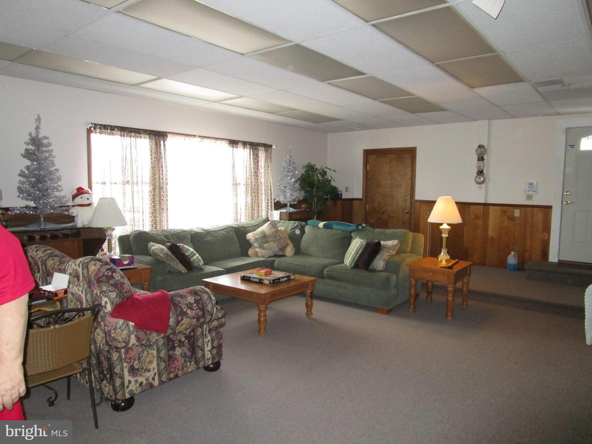 25331 Military Road Cascade, MD 21719 - Photo 11 of 13 a living room with furniture and a large window