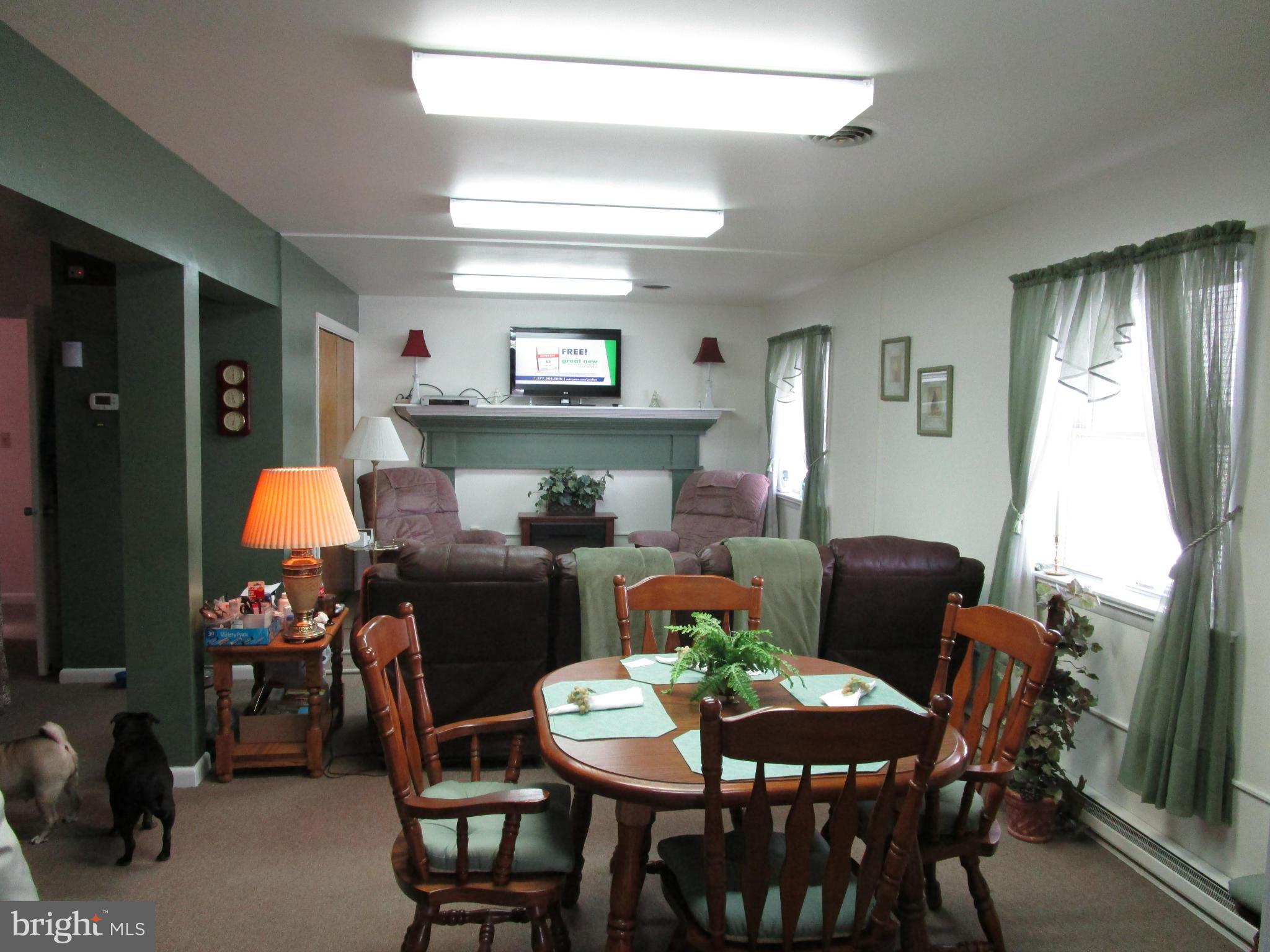 25331 Military Road Cascade, MD 21719 - Photo 3 of 13 a dining room with furniture and window