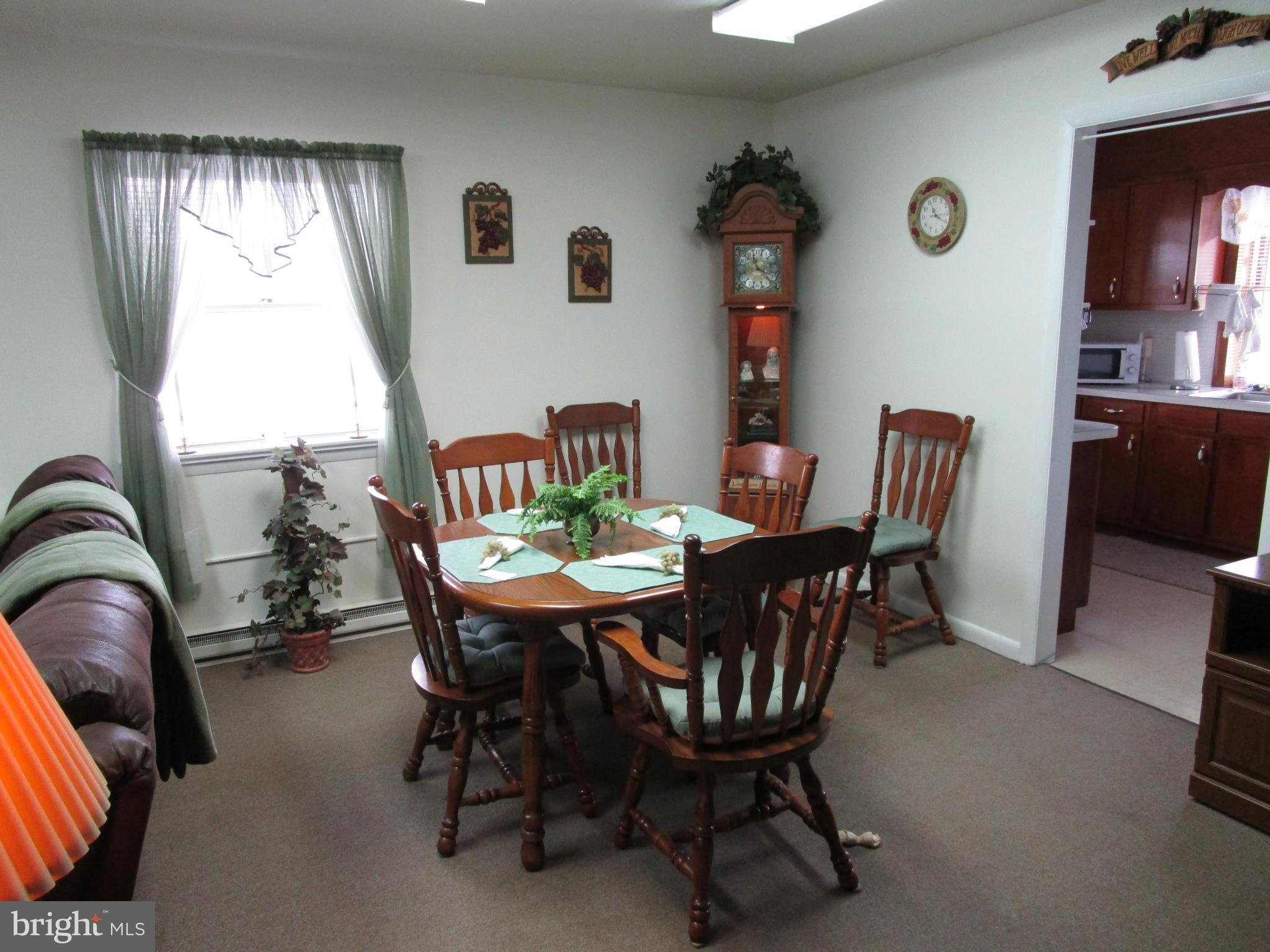 25331 Military Road Cascade, MD 21719 - Photo 4 of 13 a view of a dining room with furniture and window
