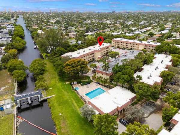 an aerial view of residential houses with outdoor space