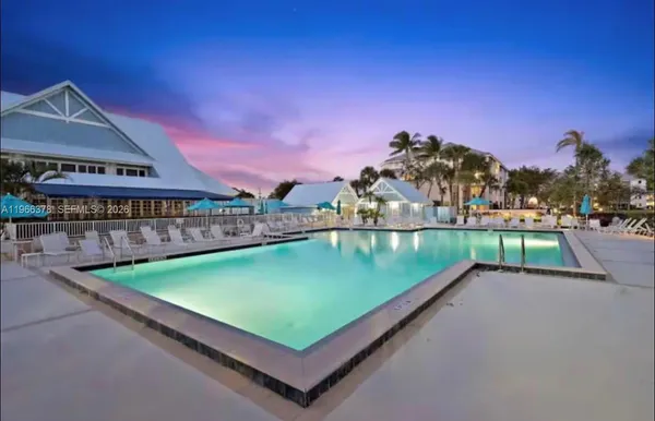 a view of a swimming pool with a yard
