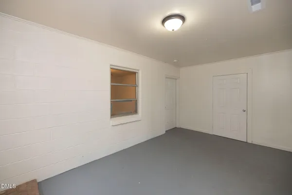 an empty room with a empty space and window