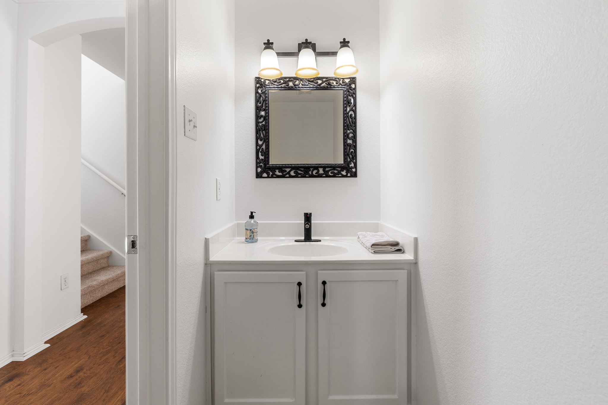 406 Golden Gate Drive Leander, TX 78641 - Photo 14 of 40 Bathroom with vanity and dark wood-type flooring