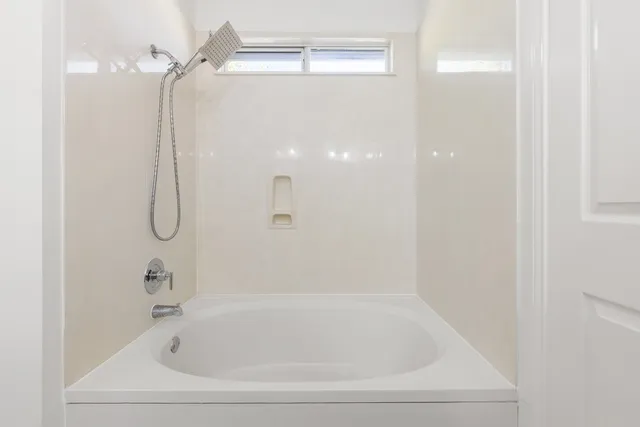 a close view of a bathtub in a bathroom